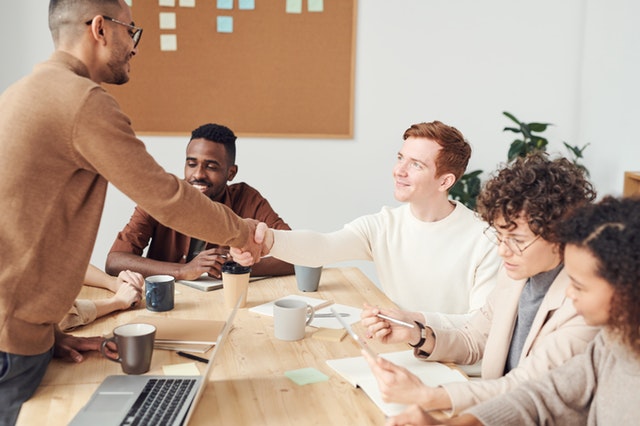 activity-tracking-buy-in 2 team members handshaking