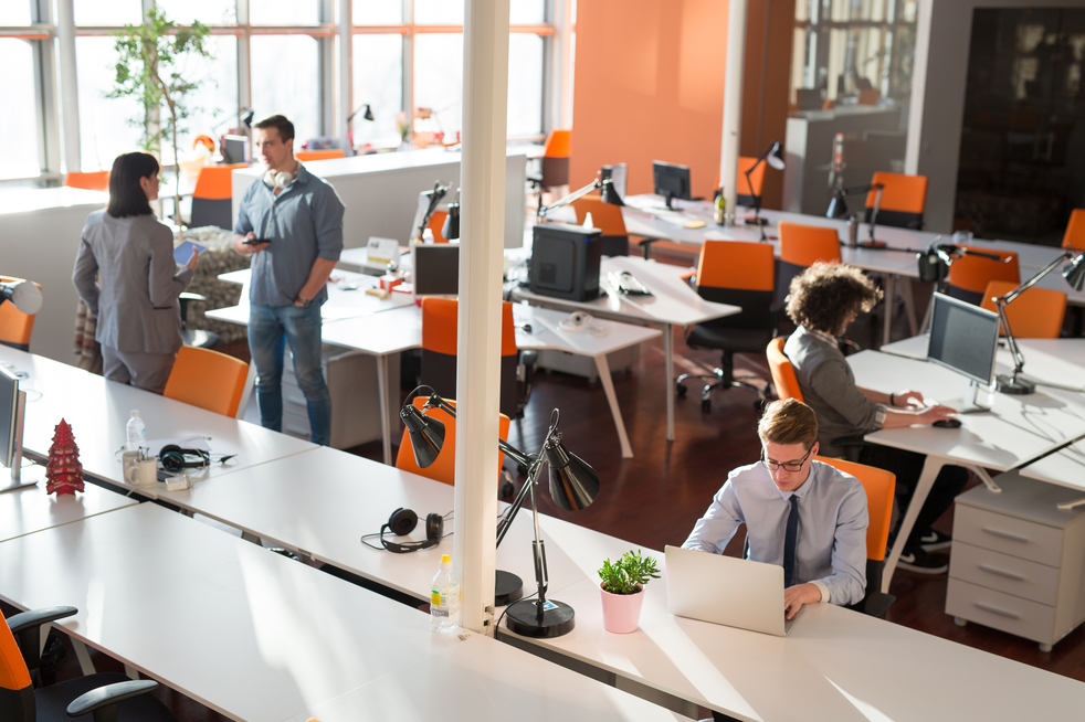 Two Business People Working With laptop in office top view of office interior