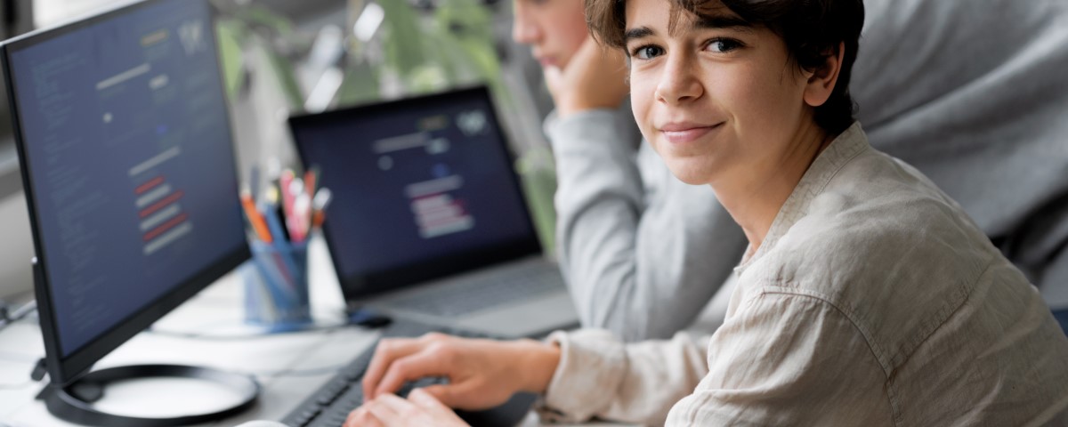 Schoolgirl In IT Class Using a Computer