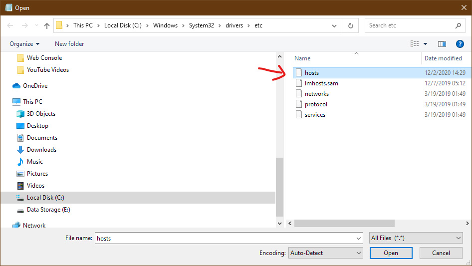 Windows File Explorer with the hosts file location open. The hosts file is highlighted
