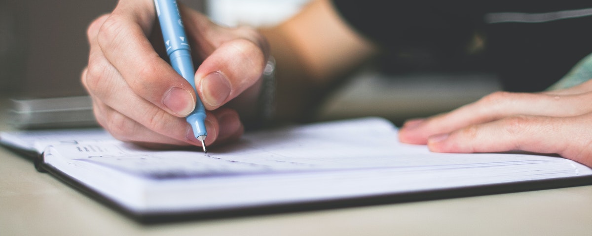 Man writing in notebook