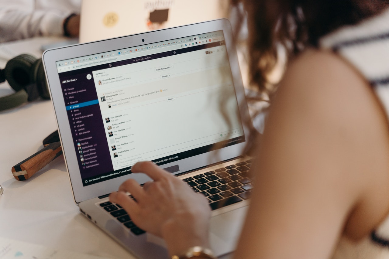 Woman using Slack, a virtual team chat platform