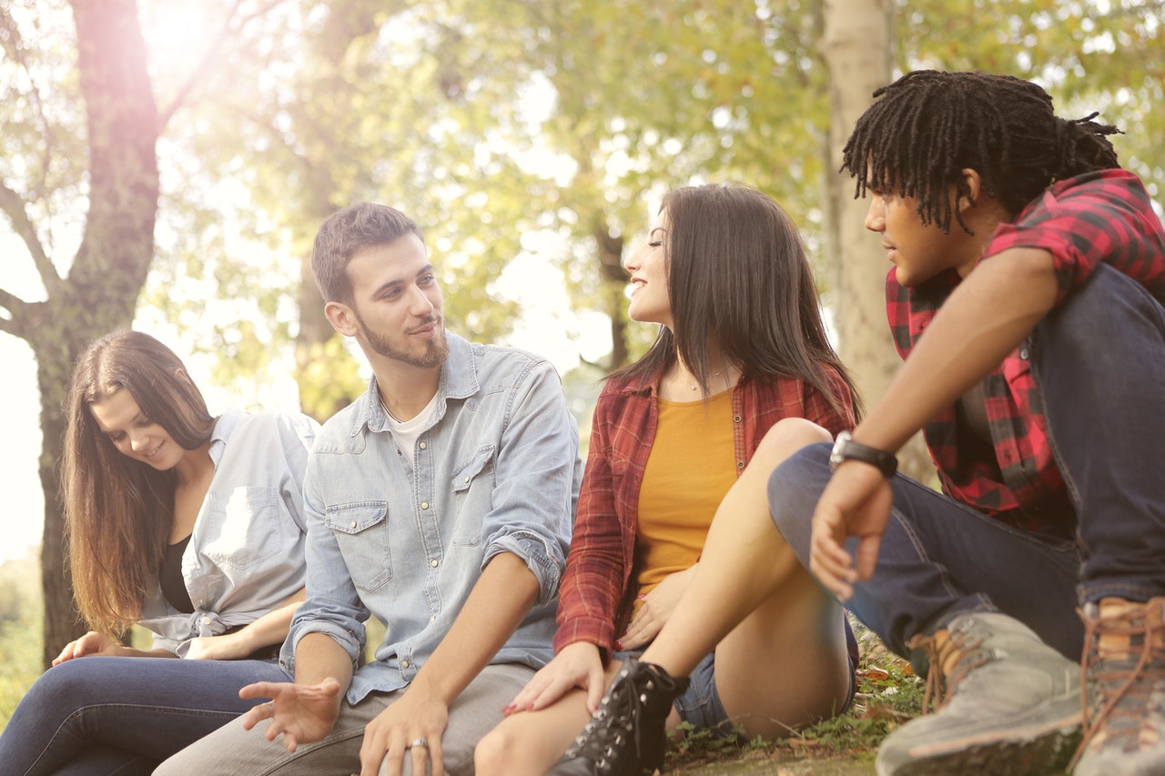 A group of four people are casually hanging out.